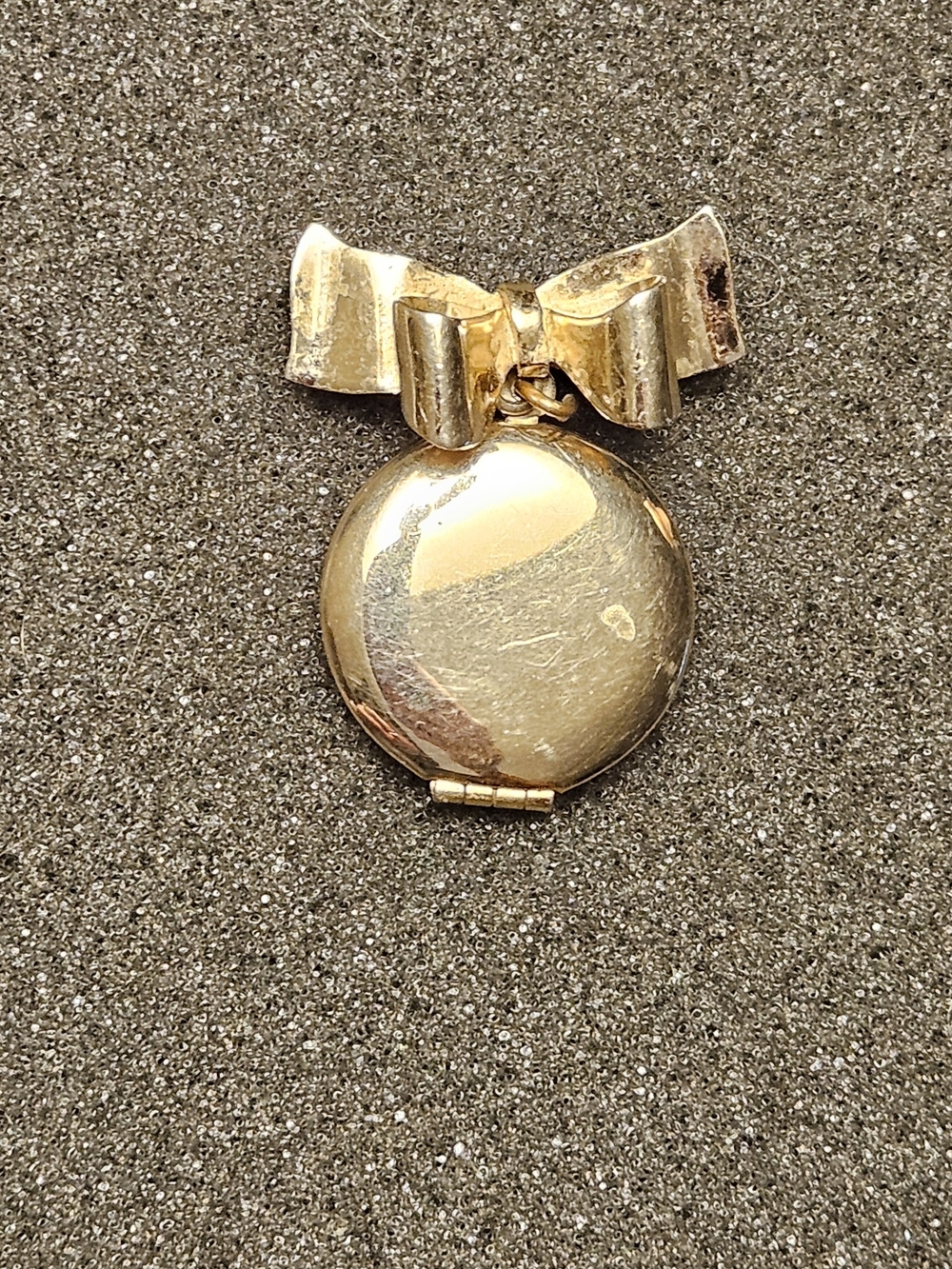 Vintage gold-tone costume Bow - Topped Locket.